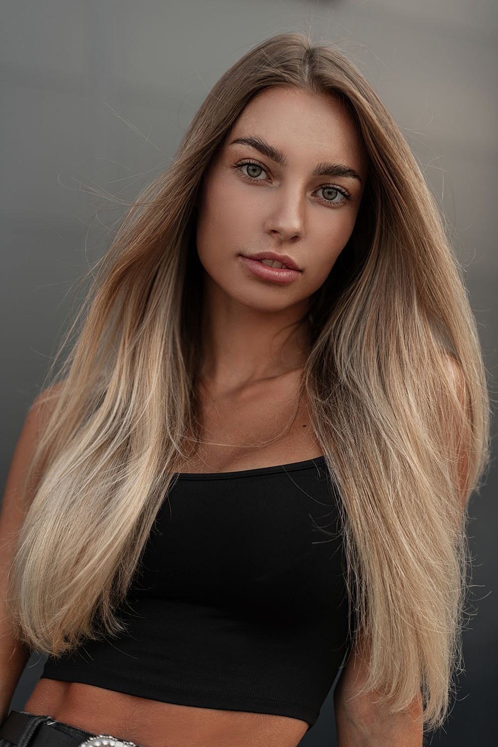 Portrait of a young woman with long hair.