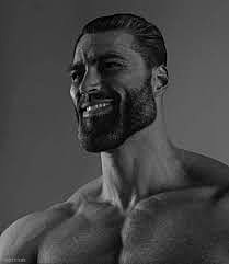 Muscular man smiling in black and white.